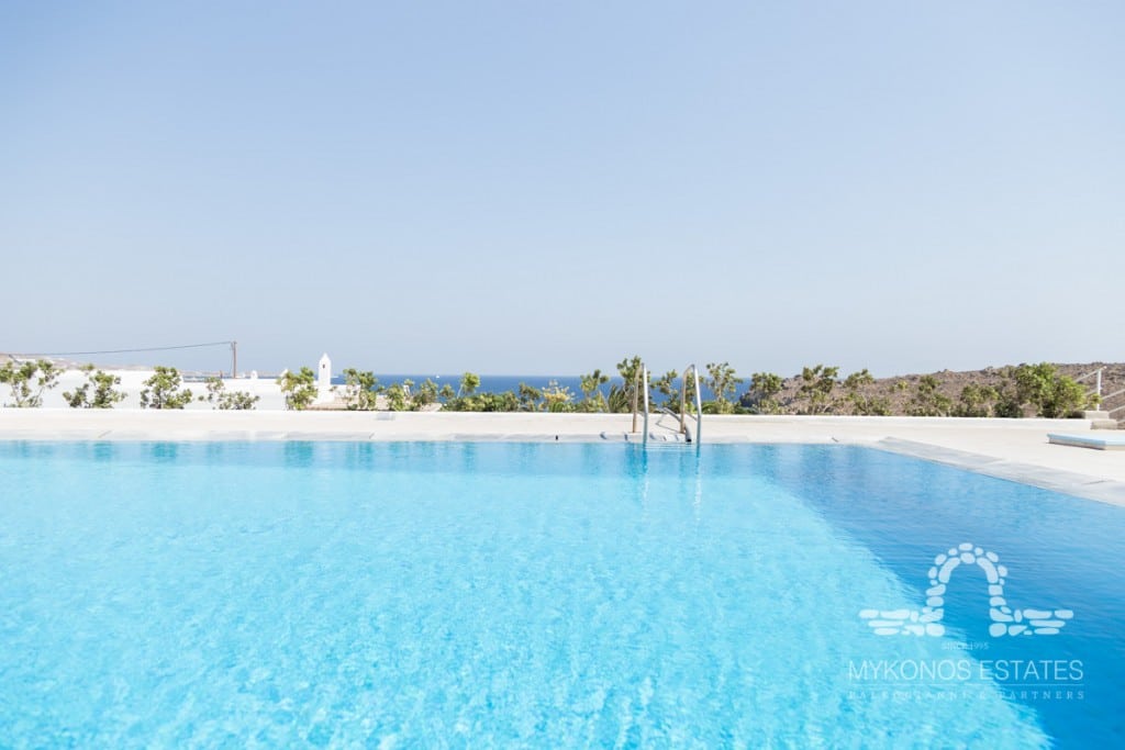 Pool with sea view under clear sky at Villa Diego, for sale in Glyfadi, Mykonos