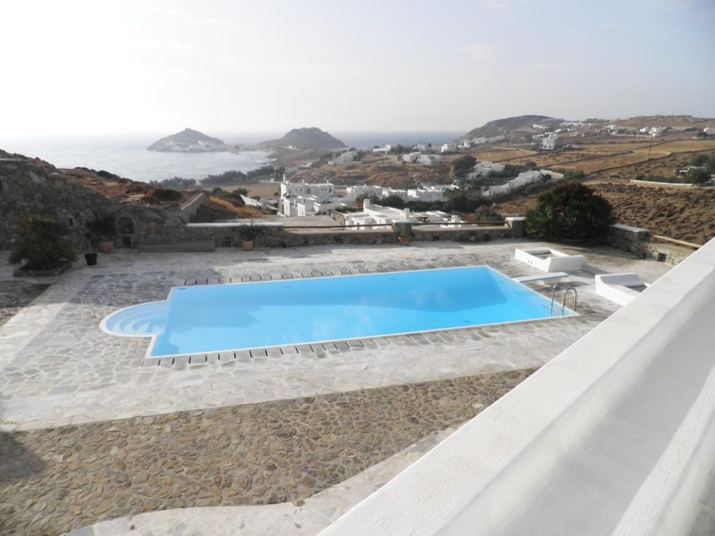 Pool and hillside with sea view at Villa Dolce in Kalafatis, Mykonos