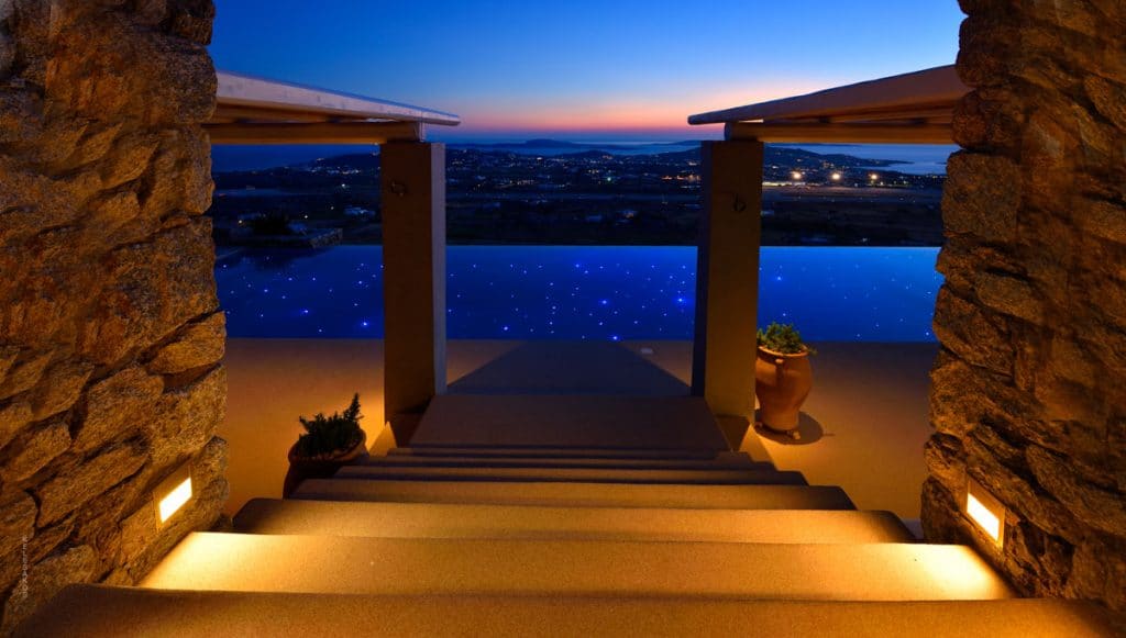 Steps to the terrace at dusk at Villa Alabaster in Kounoupas, Mykonos