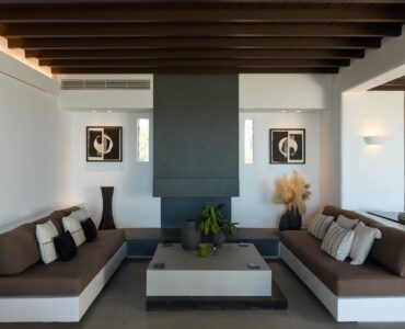 Lounge with built-in sofas at Villa Alabaster, Kounoupas, Mykonos
