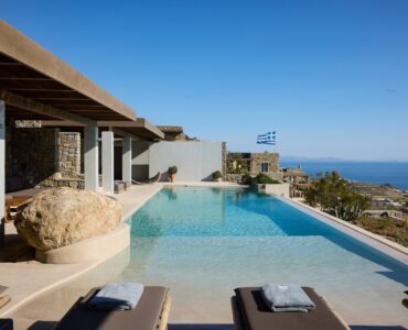 Pool terrace with sun loungers at Villa Alabaster, Kounoupas, Mykonos