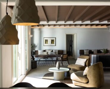 Spacious living room with fireplace at Villa Alabaster, Kounoupas, Mykonos