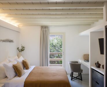 Double bedroom with garden-view window at Villa Sunstone, Kounoupas, Mykonos