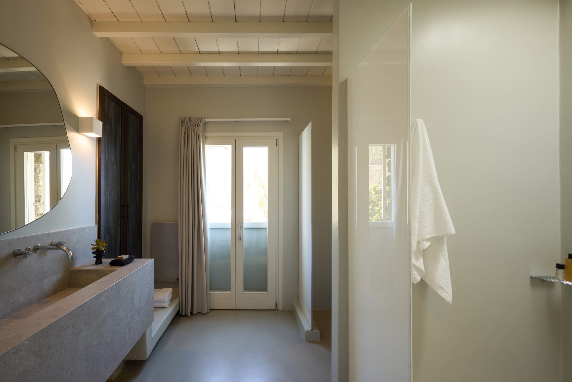 En-suite bathroom with walk-in shower at Villa Sunstone, Kounoupas, Mykonos