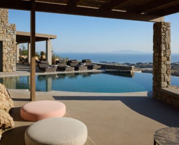 Shaded pool lounge with sea view at Villa Sunstone, Kounoupas, Mykonos