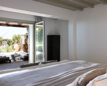 Bedroom opening to the garden terrace at Villa Amethyst, Kounoupas, Mykonos