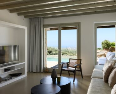 Living room with pool view at Villa Amethyst, Kounoupas, Mykonos