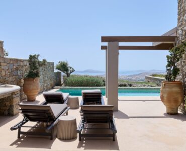 Sun loungers on the pool terrace at Villa Amethyst, Kounoupas, Mykonos