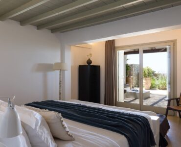 Bedroom with garden-view terrace at Villa Ammolite, Kounoupas, Mykonos
