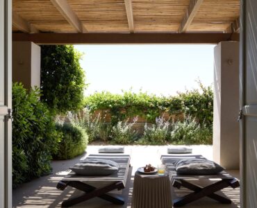 Covered terrace opening to the garden at Villa Ammolite, Kounoupas, Mykonos