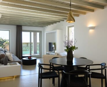Living and dining area with garden view at Villa Ammolite, Kounoupas, Mykonos