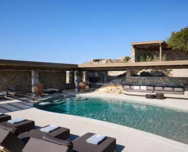 Pool area with shaded pergola lounges at Villa Moonstone, Kounoupas, Mykonos