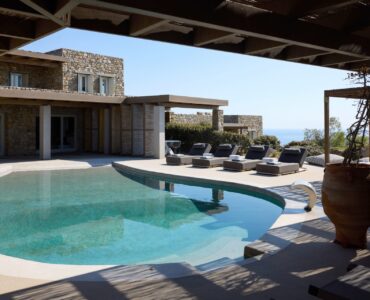 Pool terrace and stone villa at Villa Moonstone, Kounoupas, Mykonos