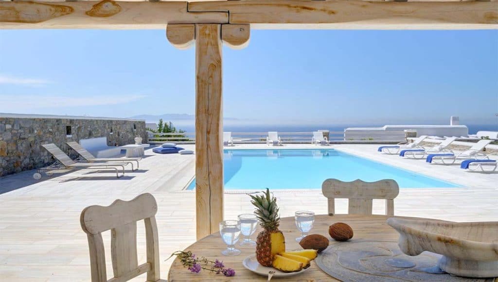 Table with fruit and pool view at Villa Ethel in Super Paradise, Mykonos