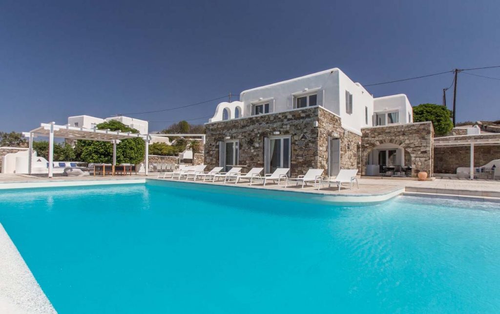 Pool and stone-and-white villa at Sea View Villa in Aleomandra, Mykonos