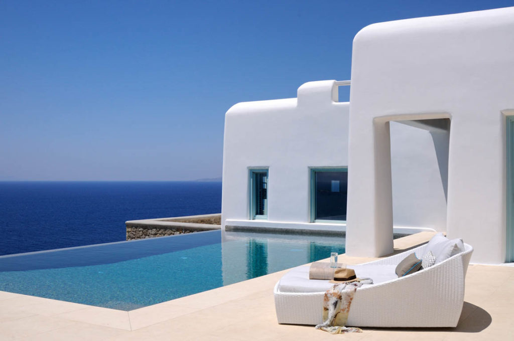 Infinity pool and white villa by the sea at Villa Corali in Pouli, Mykonos
