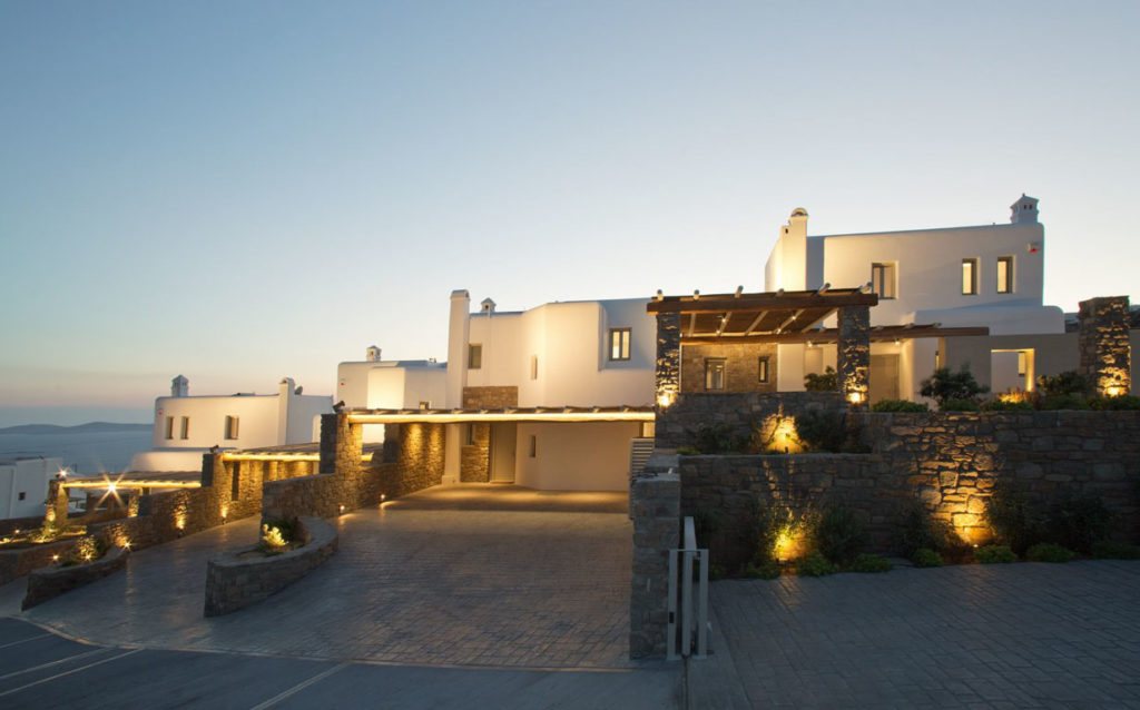 Villa complex lit at dusk at M Residence in Agia Sofia, Mykonos