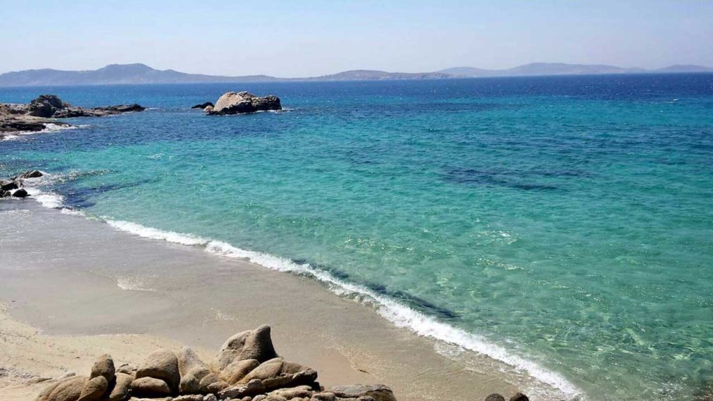 Turquoise water at a sandy beach at Villa Laguna, for sale in Aleomandra, Mykonos
