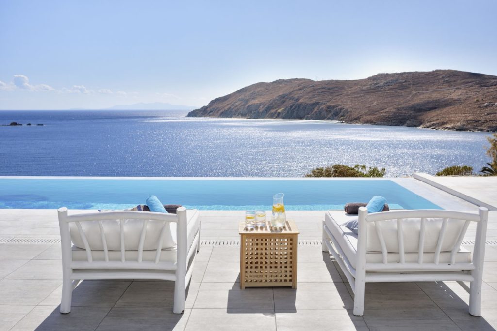 Terrace sofas by the infinity pool at Villagio Resort in Kalo Livadi, Mykonos