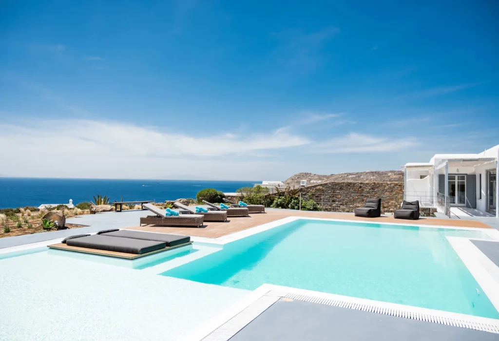 Large pool with a sunken lounge and sea view at Villa Freya in Elia, Mykonos