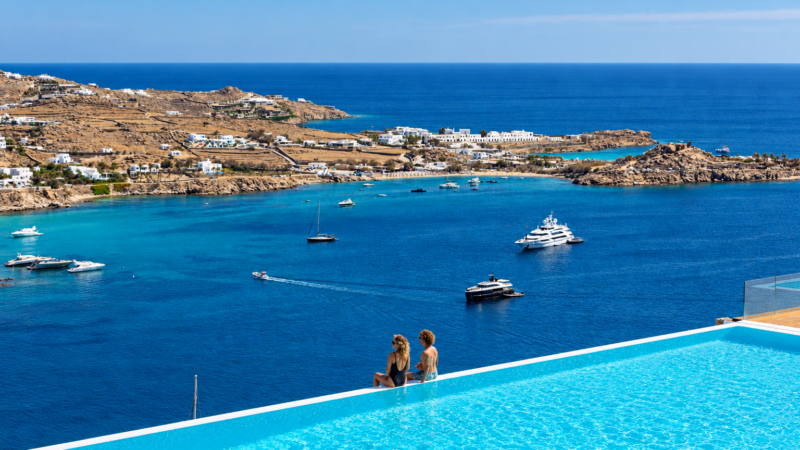 Infinity pool with sea view over the bay and yachts at Villa Nafsithoi, Agios Lazaros, Mykonos