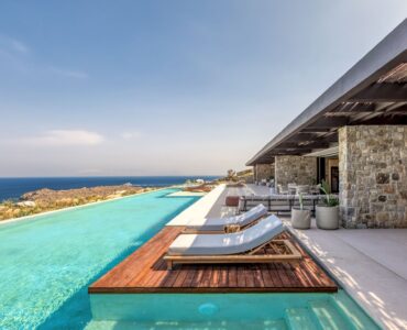 Infinity pool with sun deck and loungers overlooking the Aegean Sea at Aether Private Retreat - Grand Villa, Aleomandra, Mykonos