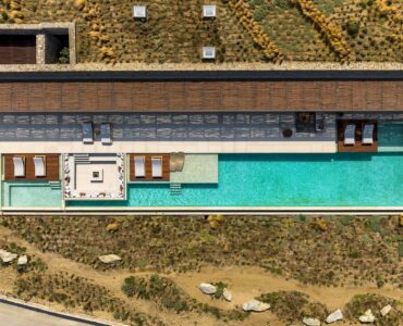Top-down aerial view of the pool deck and sun loungers at Aether Private Retreat - Grand Villa, Aleomandra, Mykonos