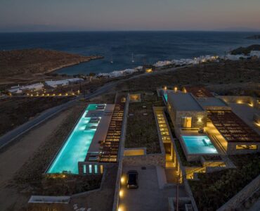 Aerial view of the villa and illuminated pools at night at Aether Private Retreat - Grand Villa, Aleomandra, Mykonos