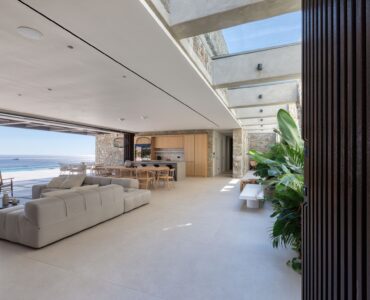 Living area with indoor planting and natural light at Aether Private Retreat - Grand Villa, Aleomandra, Mykonos