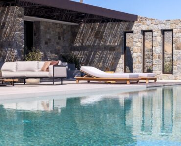 Pool terrace with shaded lounge area and sea views at Aether Private Retreat - Grand Villa, Aleomandra, Mykonos
