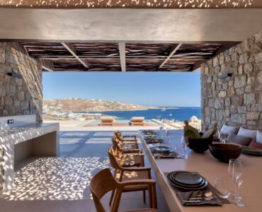 Outdoor dining table with views over the Aegean at Aether Private Retreat - Grand Villa, Aleomandra, Mykonos