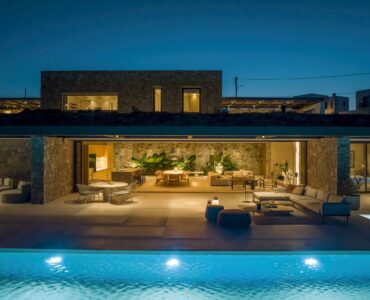 Villa and illuminated pool at night at Aether Private Retreat - Grand Villa, Aleomandra, Mykonos