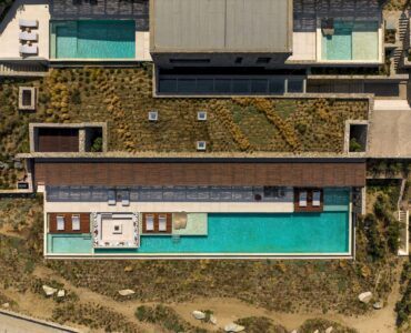 Top-down aerial view of the pool deck and sun loungers at Aether Private Retreat - Grand Villa, Aleomandra, Mykonos