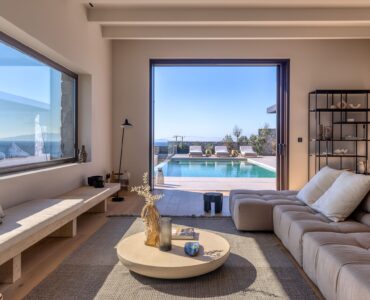 Contemporary living room with sofas and panoramic windows at Aether Private Retreat - Grand Villa, Aleomandra, Mykonos