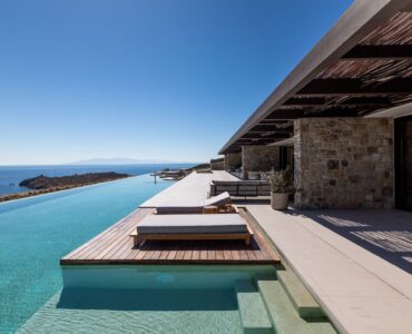 Infinity pool with sun deck and loungers overlooking the Aegean Sea at Aether Private Retreat - Grand Villa, Aleomandra, Mykonos