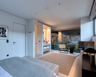 Bedroom with open en-suite bathroom at Aether Private Retreat - Grand Villa, Aleomandra, Mykonos