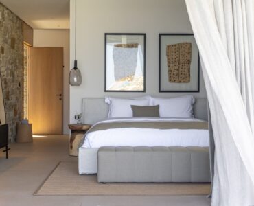Bedroom with natural textures and soft neutral tones at Aether Private Retreat - Grand Villa, Aleomandra, Mykonos