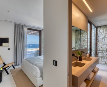 Bedroom with open en-suite bathroom at Aether Private Retreat - Grand Villa, Aleomandra, Mykonos