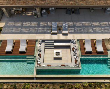 Top-down aerial view of the pool deck and sun loungers at Aether Private Retreat - Grand Villa, Aleomandra, Mykonos