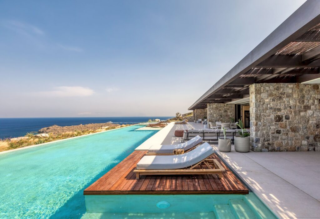 Infinity pool with sun deck and loungers overlooking the Aegean Sea at Aether Private Retreat - Ground Floor, Aleomandra, Mykonos