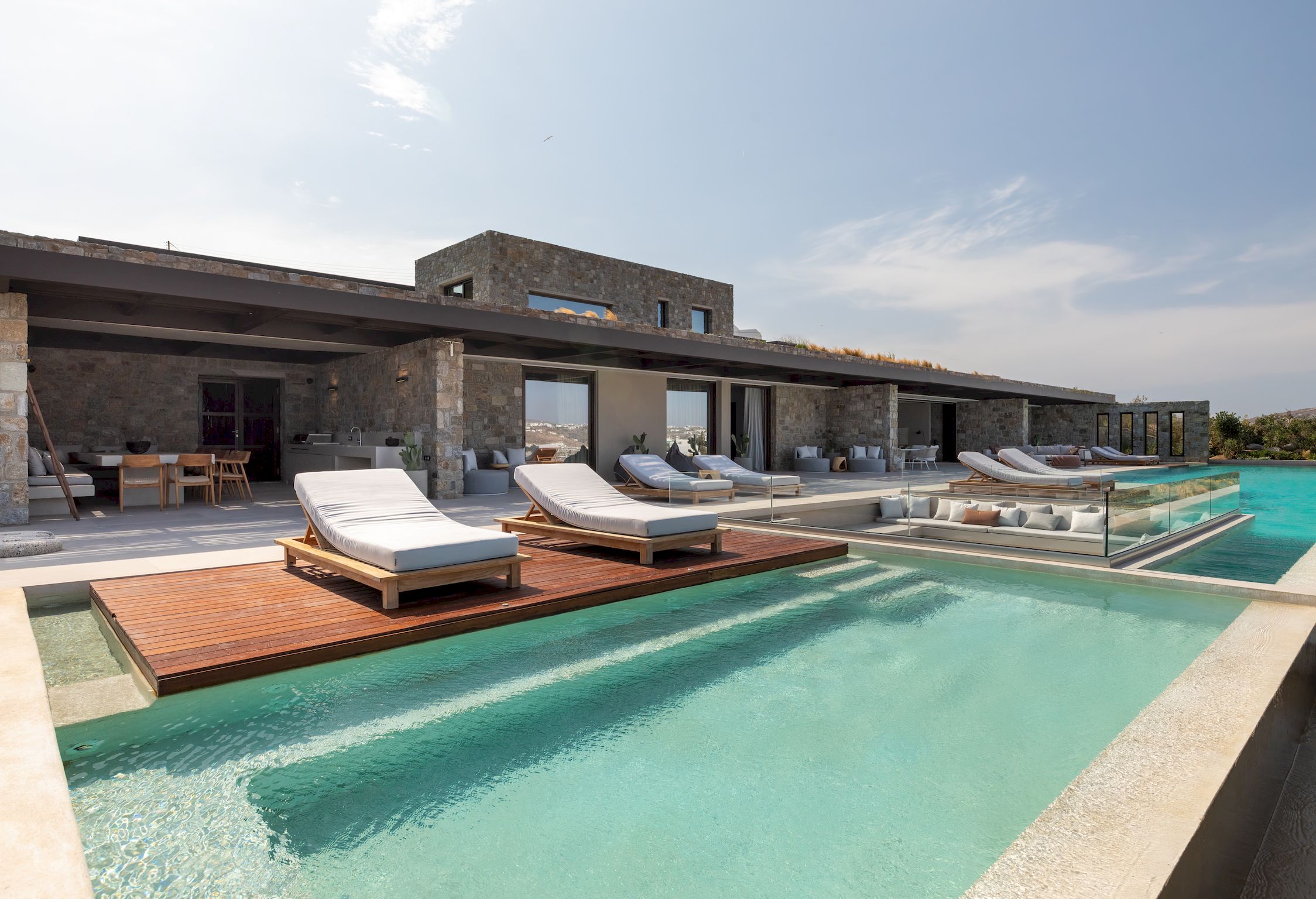 Private pool with sun loungers beside the stone-built villa at Aether Private Retreat - Ground Floor, Aleomandra, Mykonos