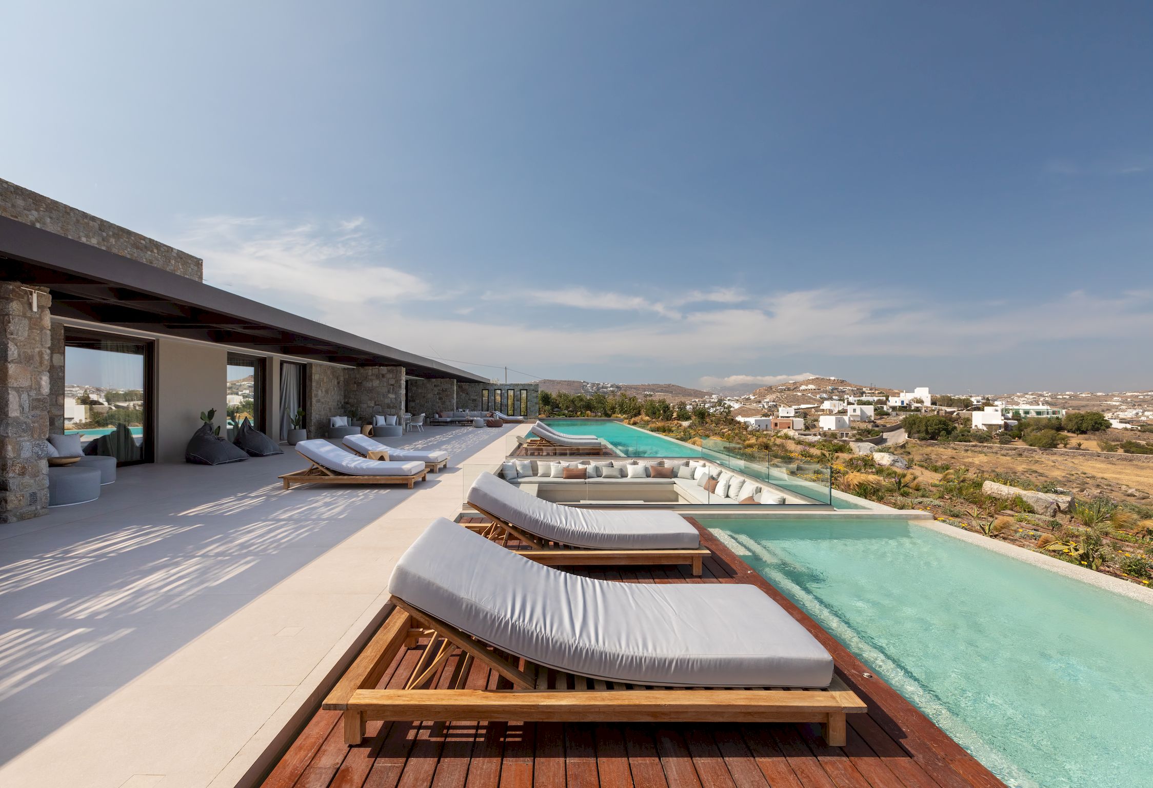 Infinity pool with sun deck and loungers overlooking the Aegean Sea at Aether Private Retreat - Ground Floor, Aleomandra, Mykonos
