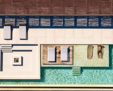Top-down aerial view of the pool deck and sun loungers at Aether Private Retreat - Ground Floor, Aleomandra, Mykonos