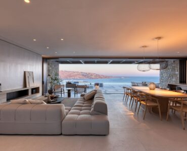 Living and dining area at sunset with views of the sea at Aether Private Retreat - Ground Floor, Aleomandra, Mykonos