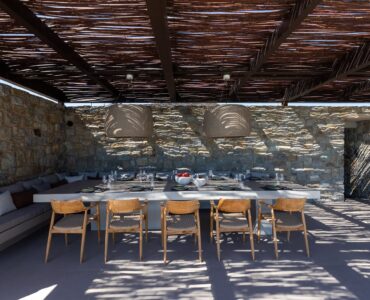 Covered outdoor dining area under a timber pergola at Aether Private Retreat - Ground Floor, Aleomandra, Mykonos