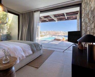 Bedroom with large window and sea view at Aether Private Retreat - Ground Floor, Aleomandra, Mykonos