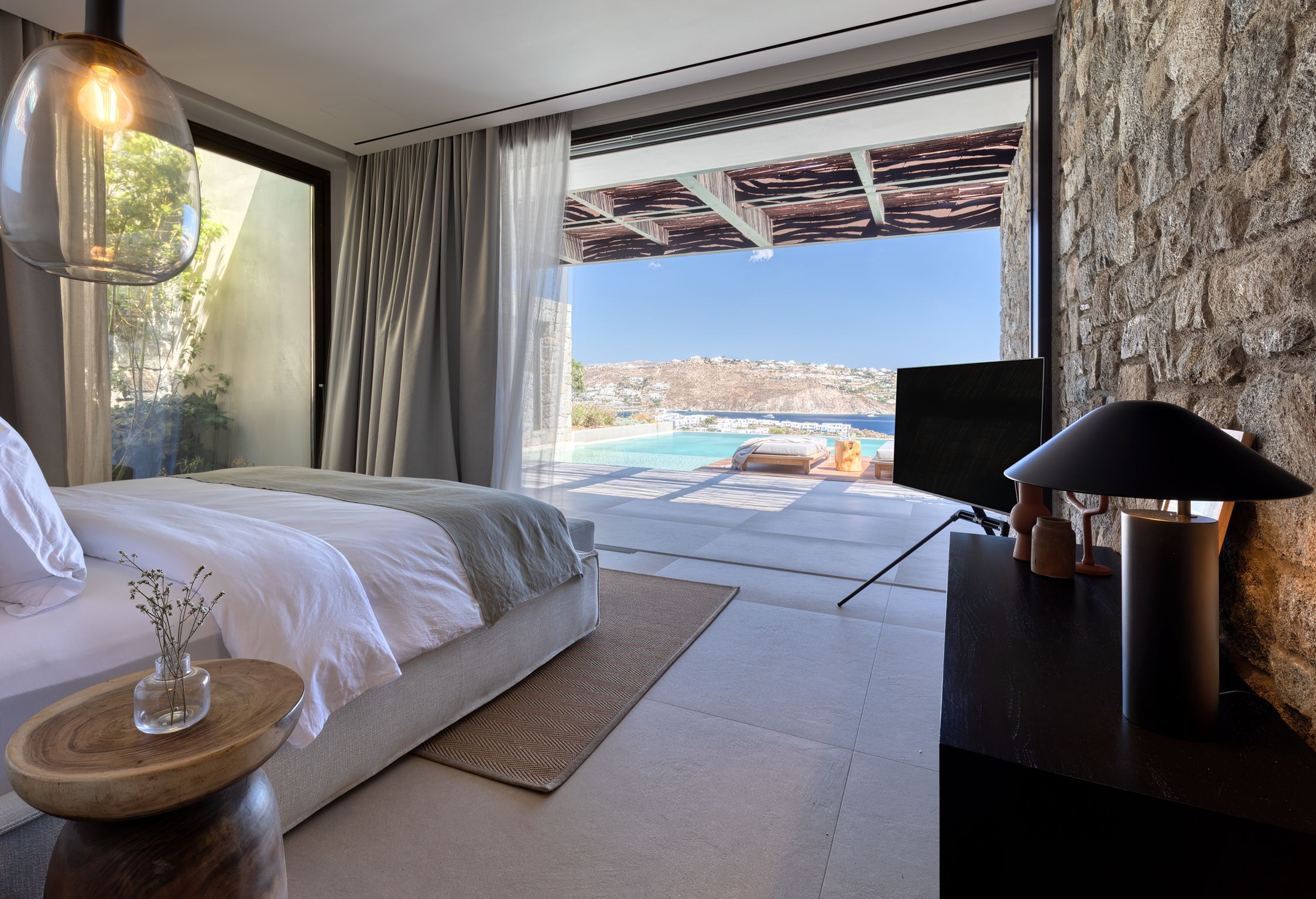 Bedroom with large window and sea view at Aether Private Retreat - Ground Floor, Aleomandra, Mykonos
