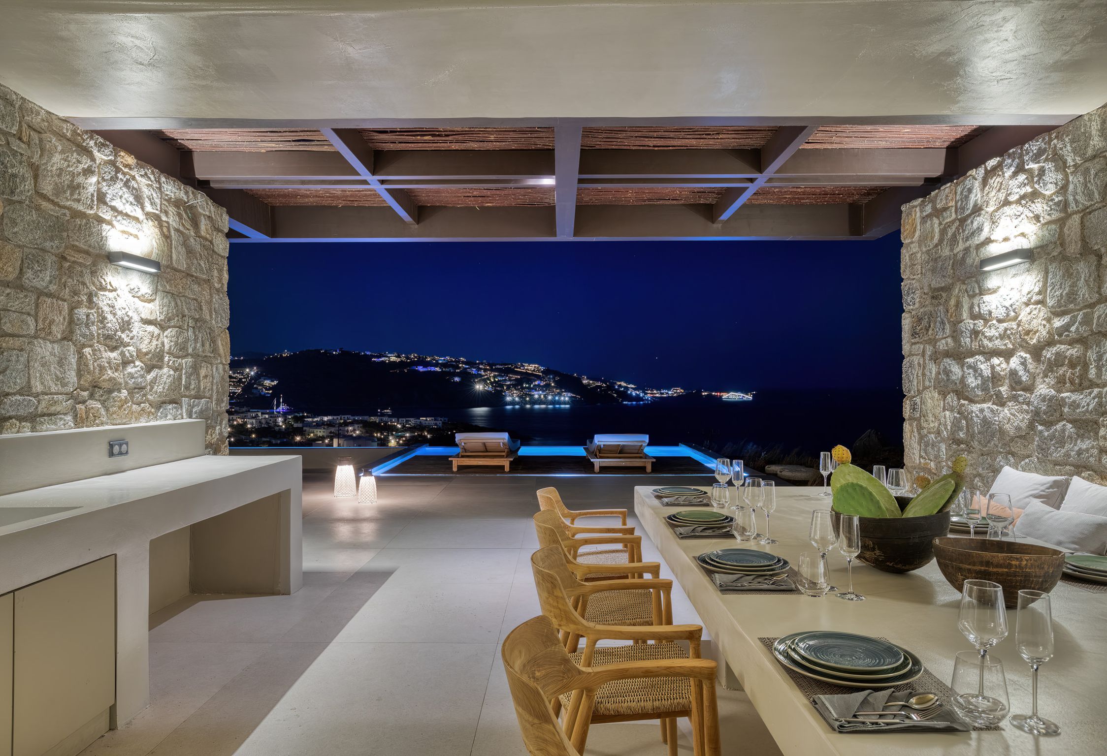 Outdoor dining area at dusk overlooking the sea at Aether Private Retreat - Ground Floor, Aleomandra, Mykonos