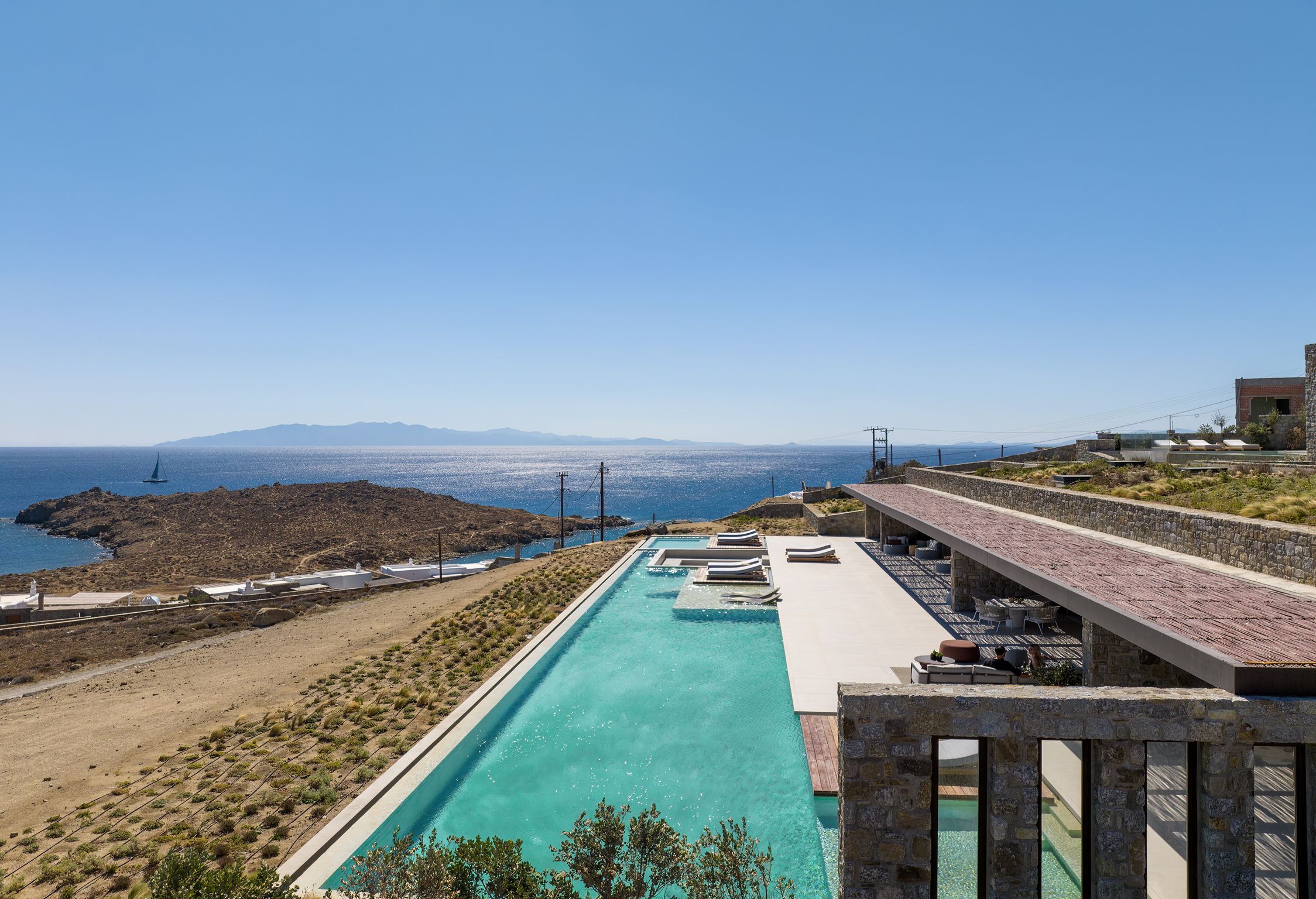 Aerial view of the villa, pools and surrounding Aleomandra landscape at Aether Private Retreat - Ground Floor, Aleomandra, Mykonos