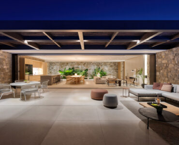 Covered outdoor lounge lit at night at Aether Private Retreat - Ground Floor, Aleomandra, Mykonos